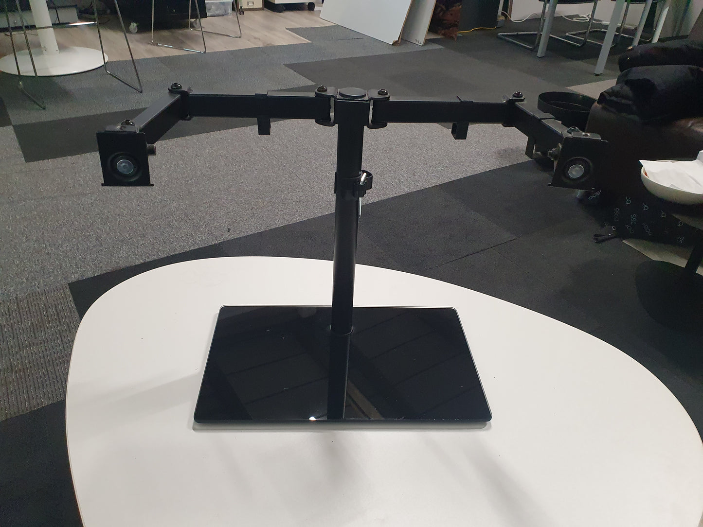 Freestanding Dual Monitor Stand with Sleek Glass Base and Adjustable Arms
