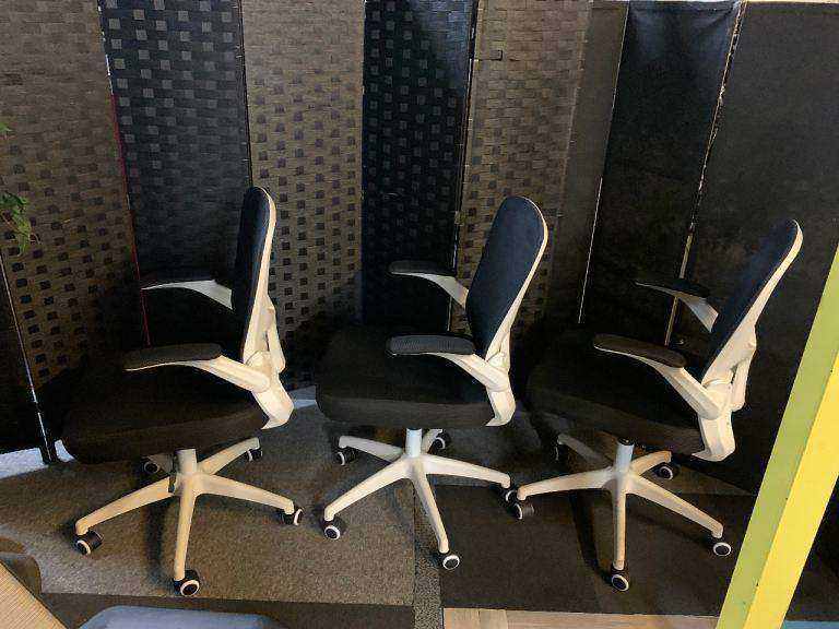 Used office adjustable swivel chair with back support Black and white contrast