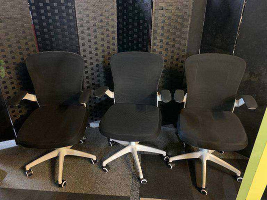Used office adjustable swivel chair with back support Black and white contrast
