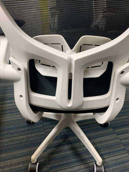 Used office adjustable swivel chair with back support Black and white contrast