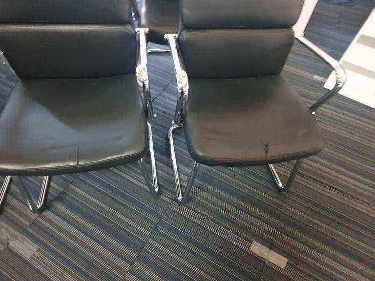 Used faux leather meeting chair Black