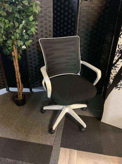 Used adjustable swivel chair Black and white contrast