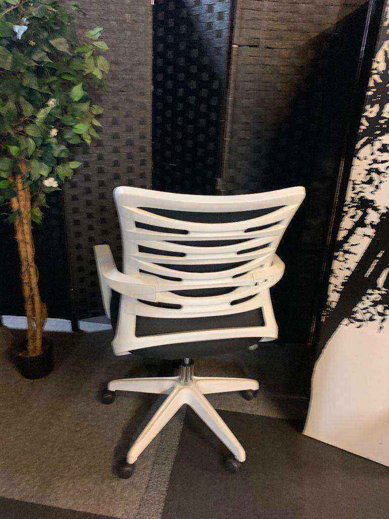 Used adjustable swivel chair Black and white contrast