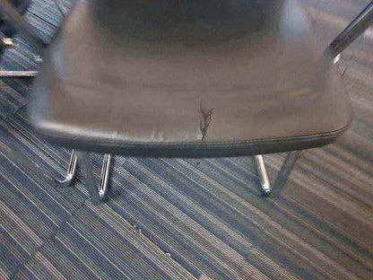 Used faux leather meeting chair Black