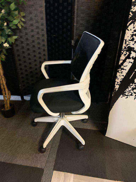 Used adjustable swivel chair Black and white contrast