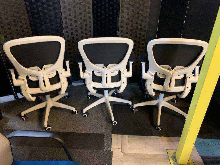 Used office adjustable swivel chair with back support Black and white contrast