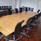 Extra large modular conference room tables and black chairs