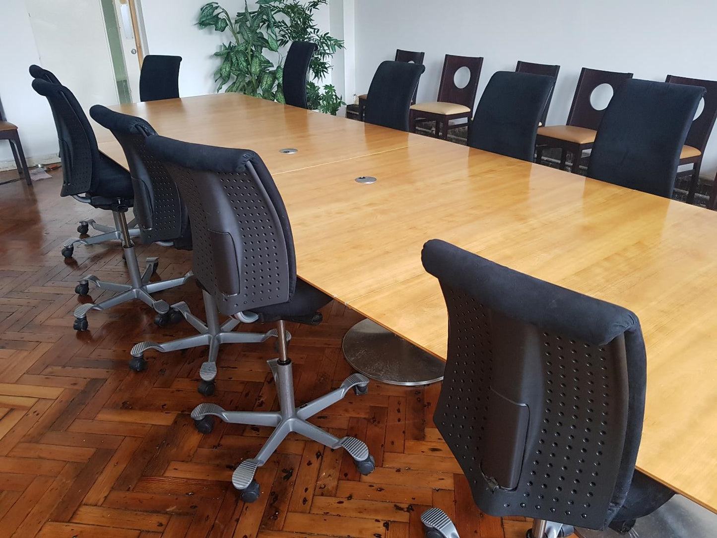 conference room table and chairs in black and brown