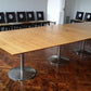 Extra large conference room table in room full of chairs