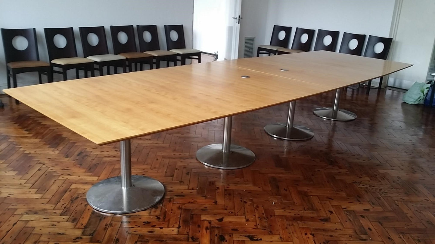 Brown Extra Large board room table in a room full of chairs