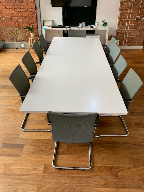 Large off white conference table and 10 meeting chairs