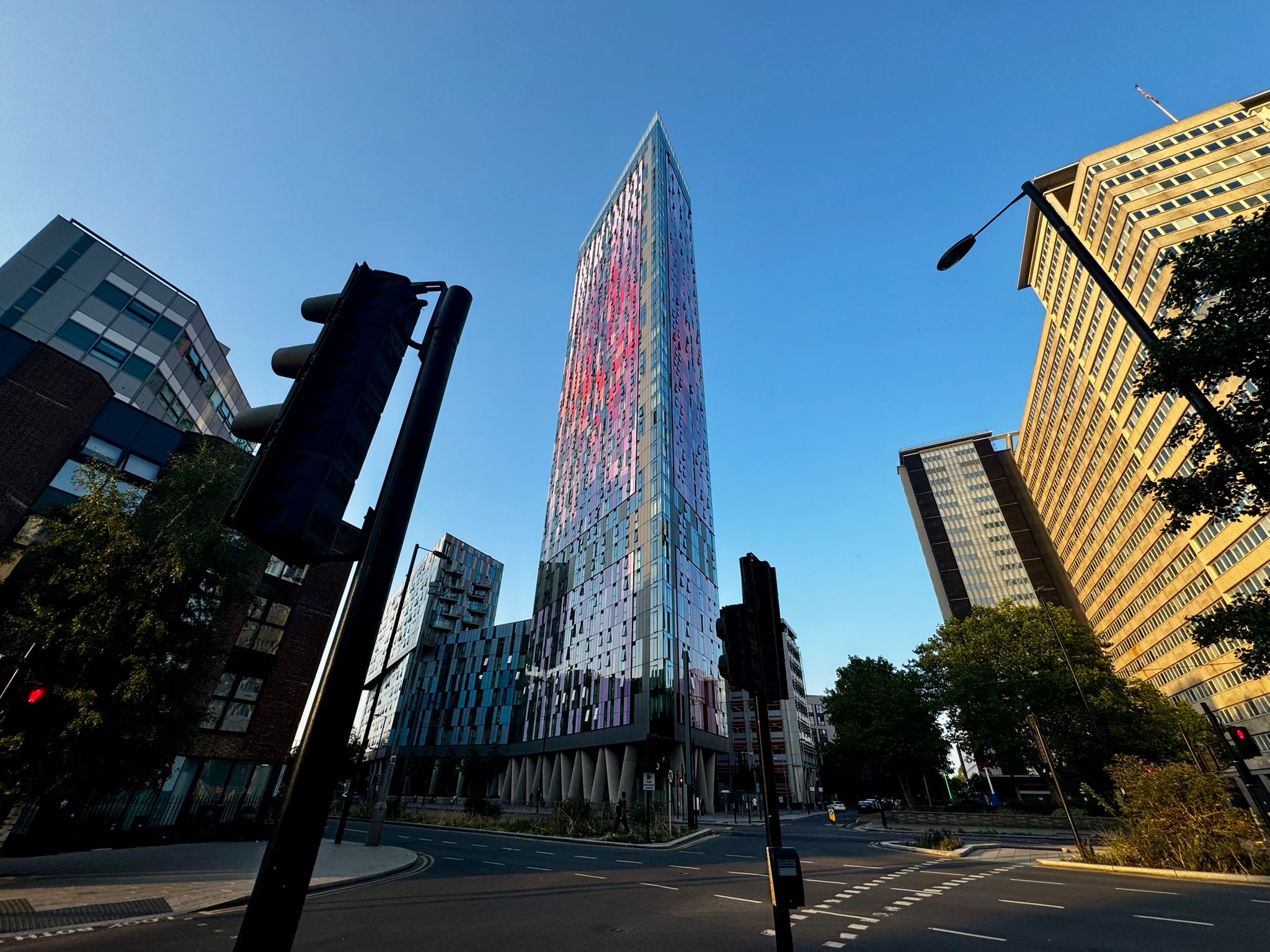 Modern cityscape with tall buildings and a clear blue sky