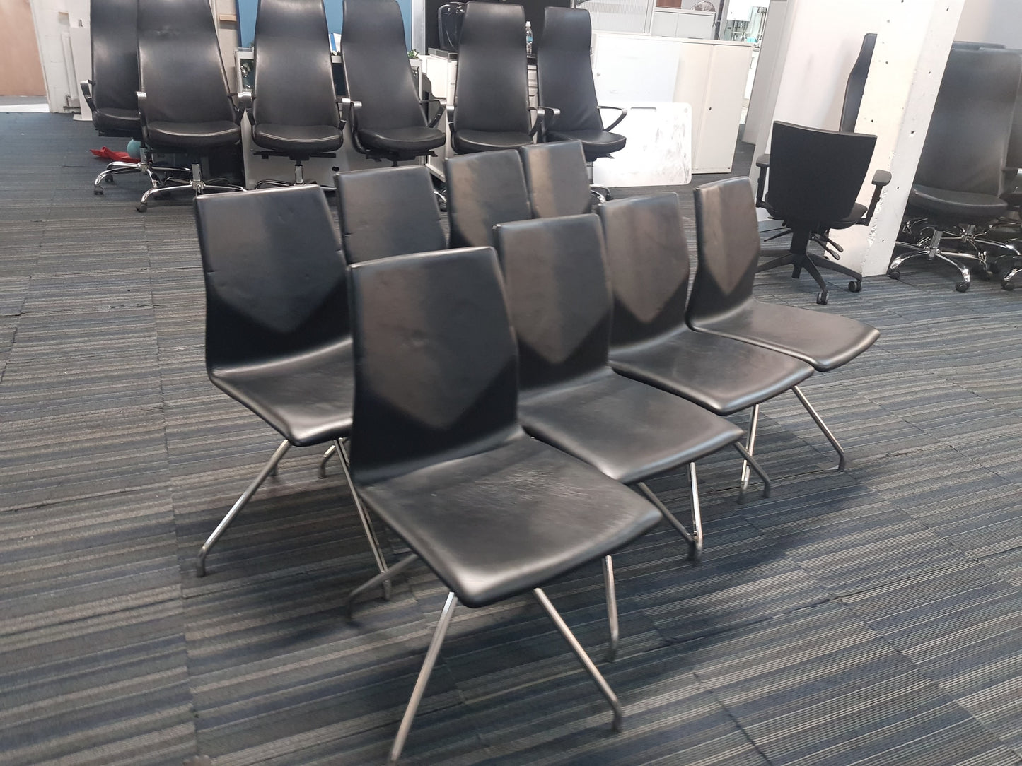 Sixteen Black Office Chairs stick and swivel