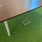 Dark brown walnut table for boardroom on green carpet