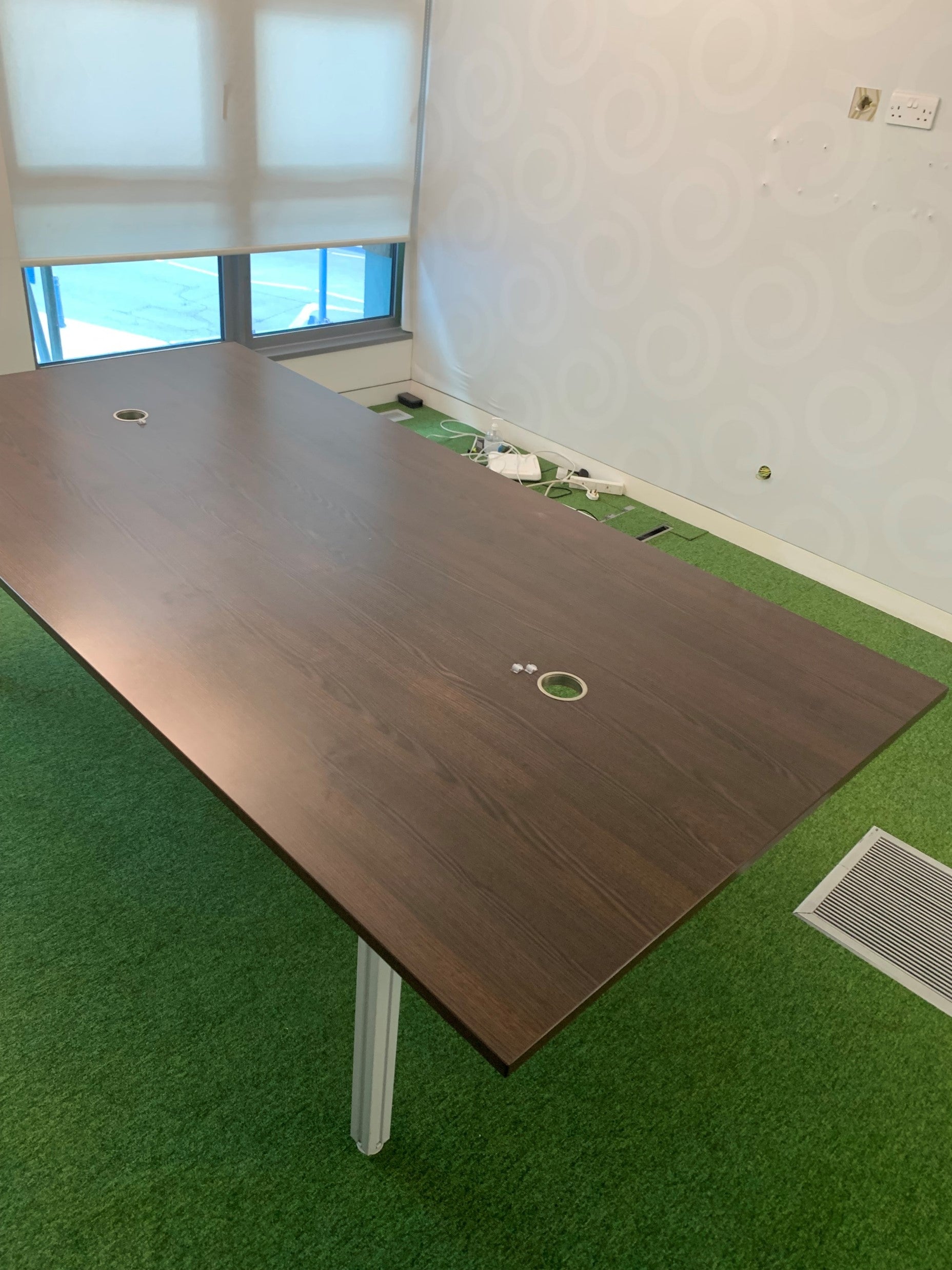 2400mm Boardroom table in walnut on green carpet