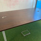 Walnut Brown office table in front of whiteboard