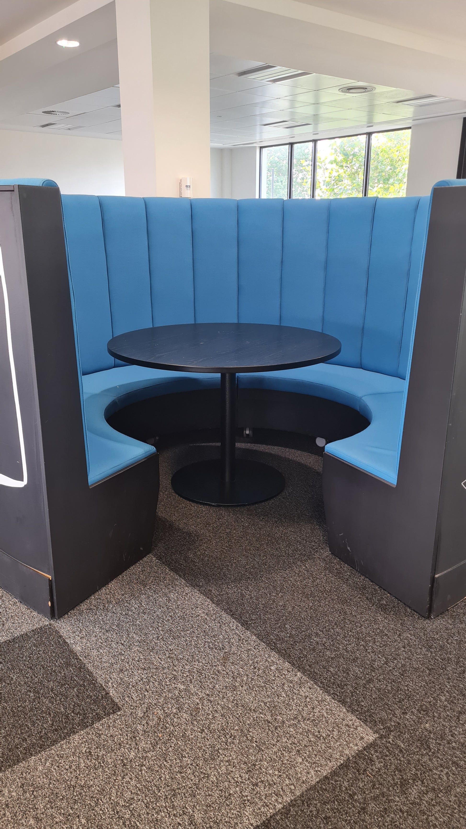 A blue and black office booth