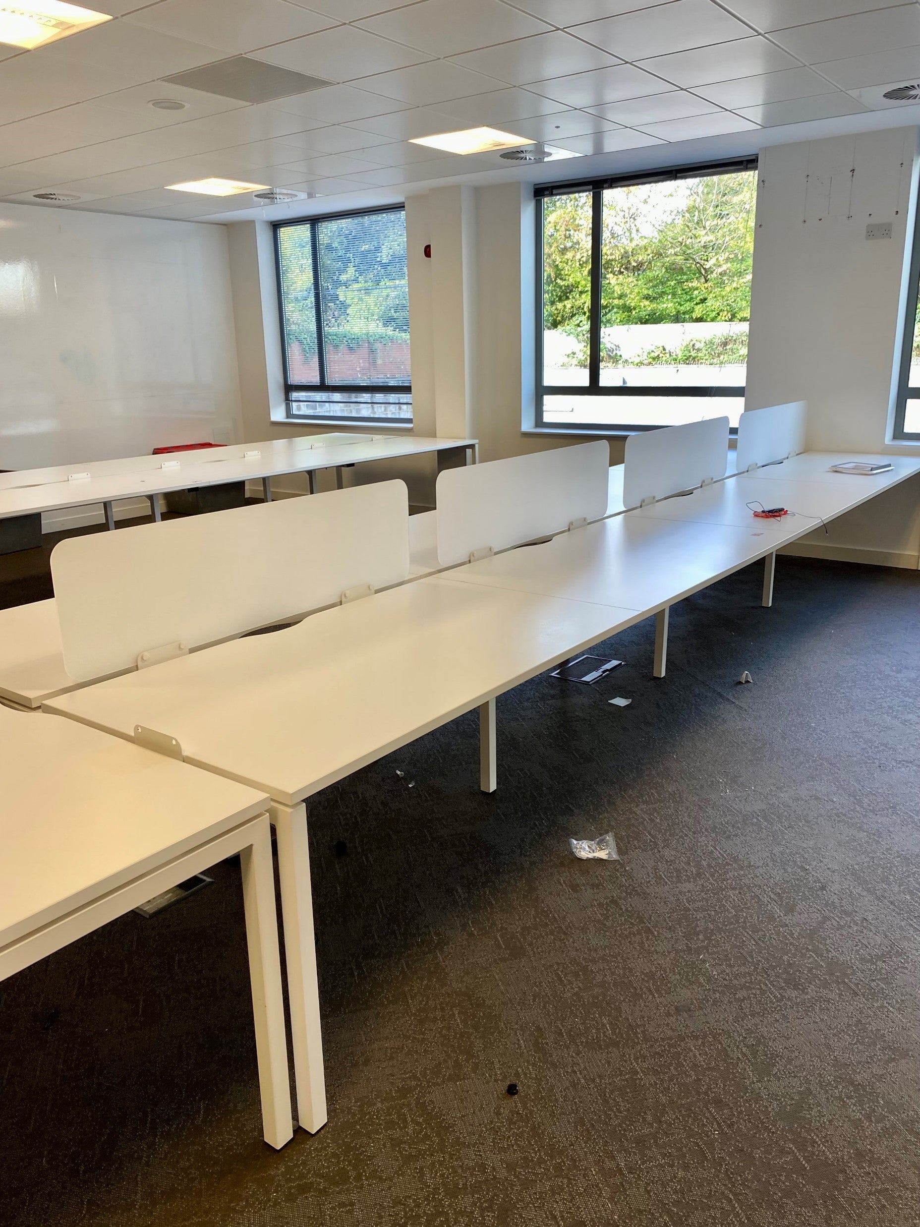 White office desk with cubicle paritions