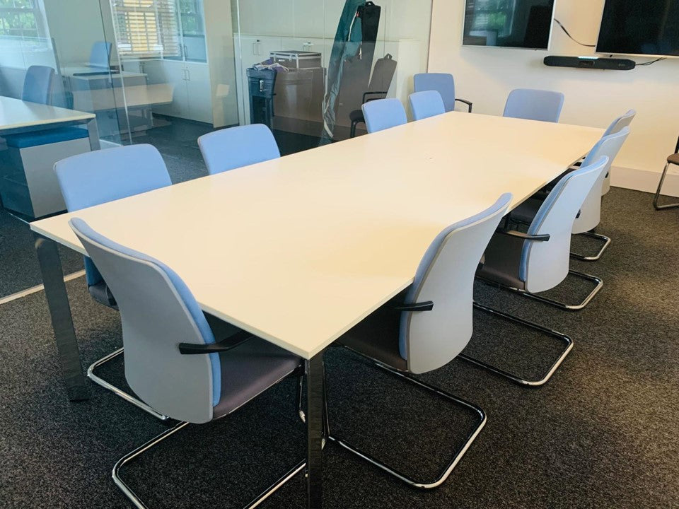 White meeting table and 10 blue chairs