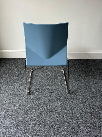 Back of blue chair on silver chrome legs