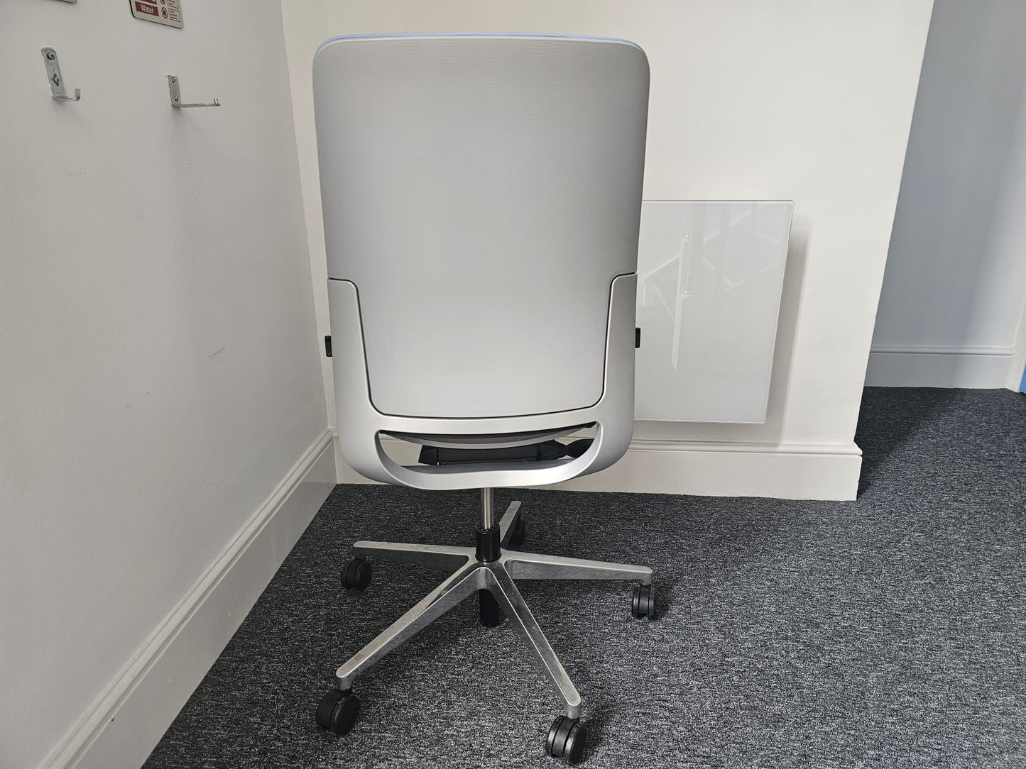 Grey back of swivel office chair