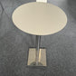 Chrome pedestal leg base and white round table