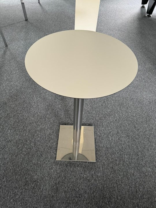 Chrome pedestal leg base and white round table