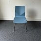 Blue plastic stacking chair