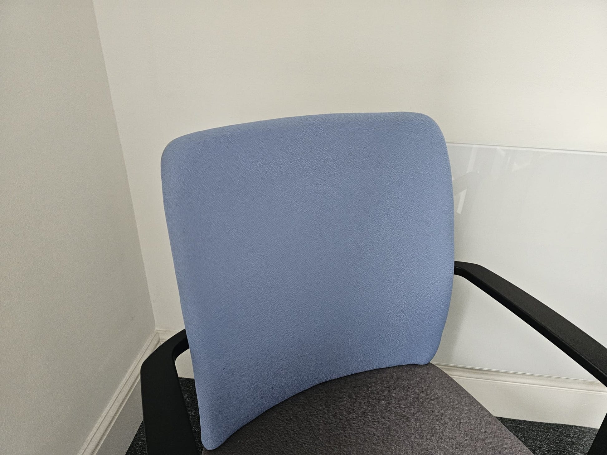 Back of blue fabric meeting chair