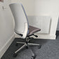 Grey office desk chair on carpet