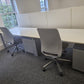 2 seater series linear pod desk with 2 grey under desk drawers and 2 swivel armless office chairs