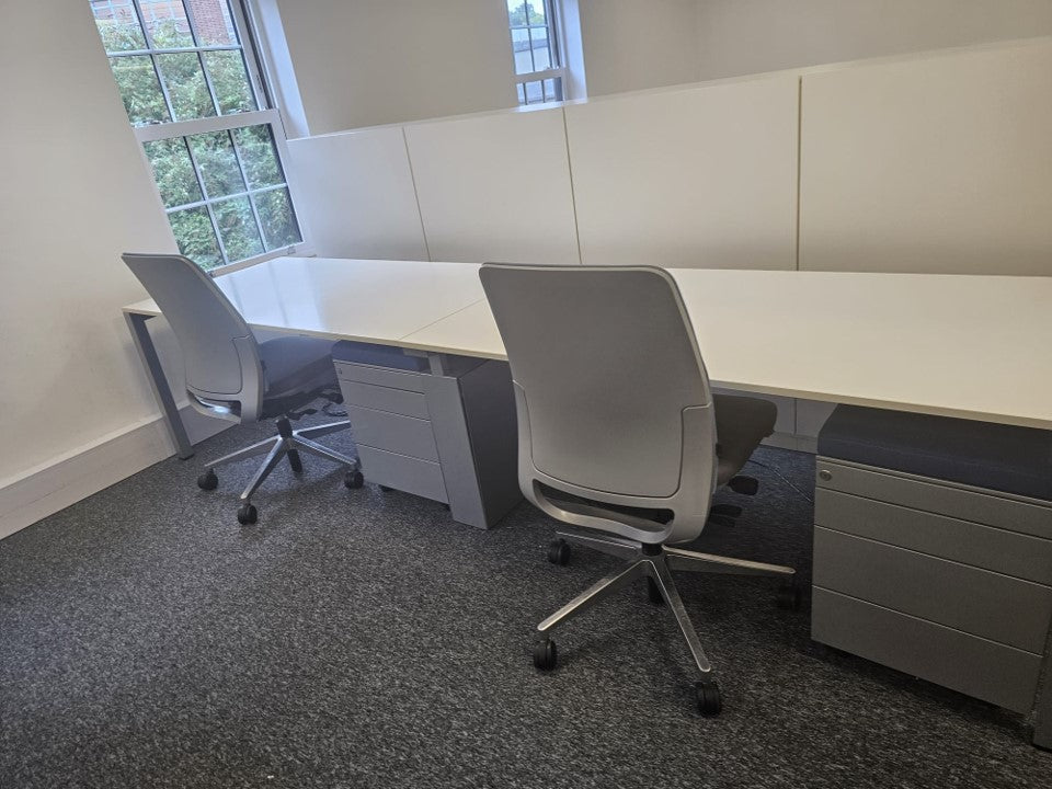 2 seater series linear pod desk with 2 grey under desk drawers and 2 swivel armless office chairs