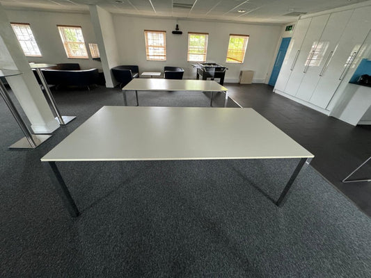 White Meeting Tables in large common room