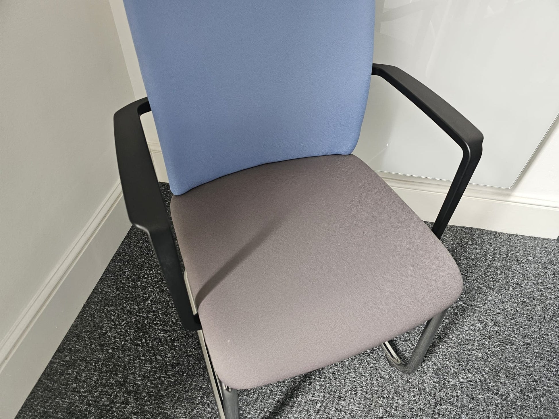 Grey Base of upholstered chair with chrome frame