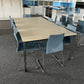 White canteen table and blue plastic chairs