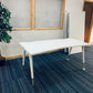 1600mm wide white office desk with green plant and folded tables