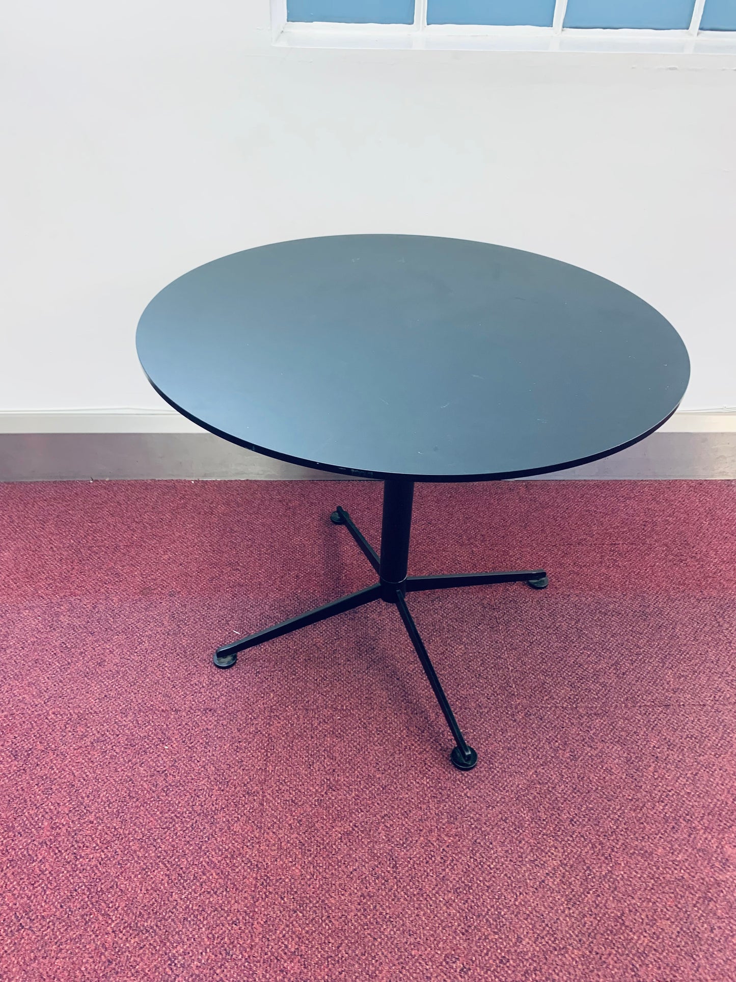 Black Paustian Office Circle Table on carpet
