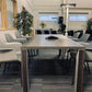 Walnut table with grey and black chairs