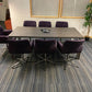 Dark brown table and seven purple chairs
