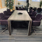 Walnut boardroom table and tall green plants