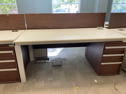 Row of white and walnut tables with large windows