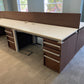 Office desks in a row in walnut and white