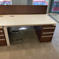 White office table with walnut divider and storagein office with large windows 