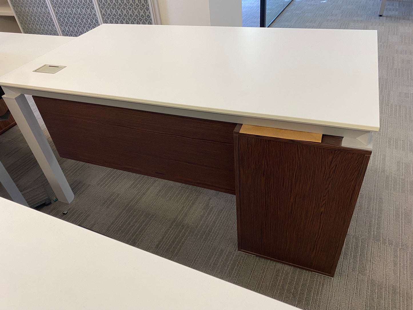 Executive office table with walnut modesty panel and drawers