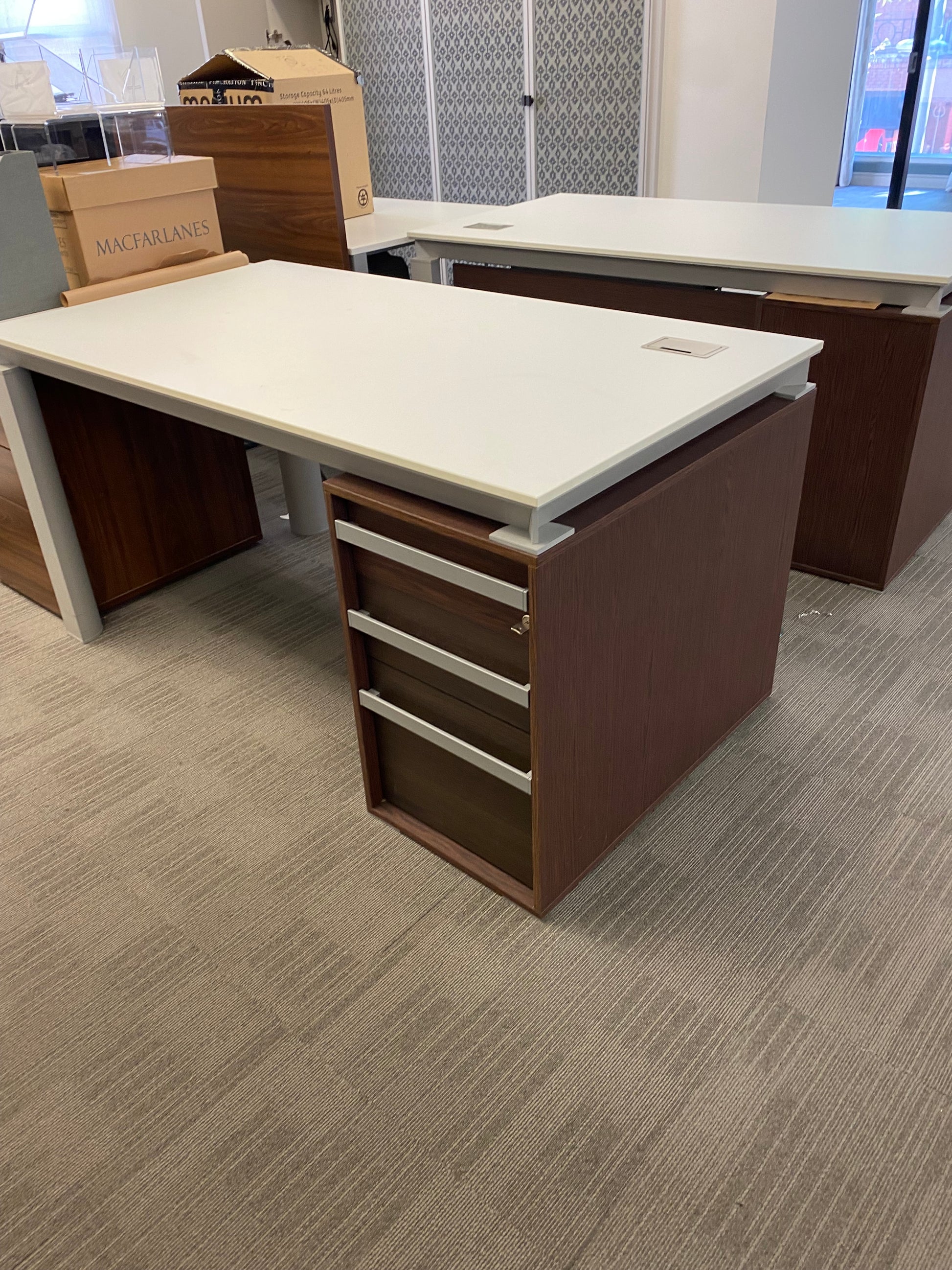 White home office table and brown storage pedestal