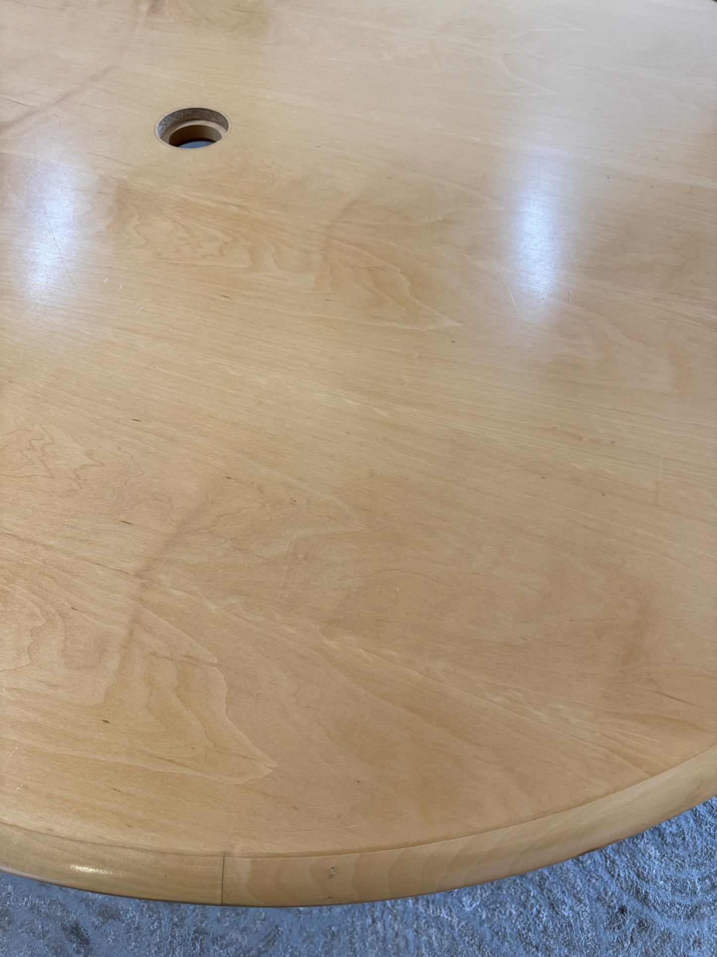 Large round office meeting table in brown