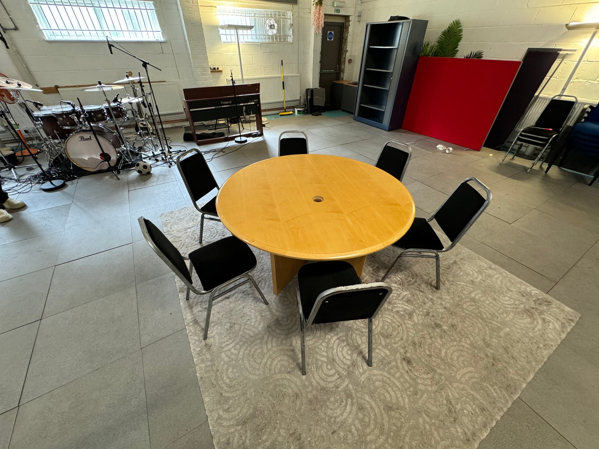 Large round office meeting table in large room