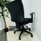 Left, tall green plant, centre, back of black swivel chair