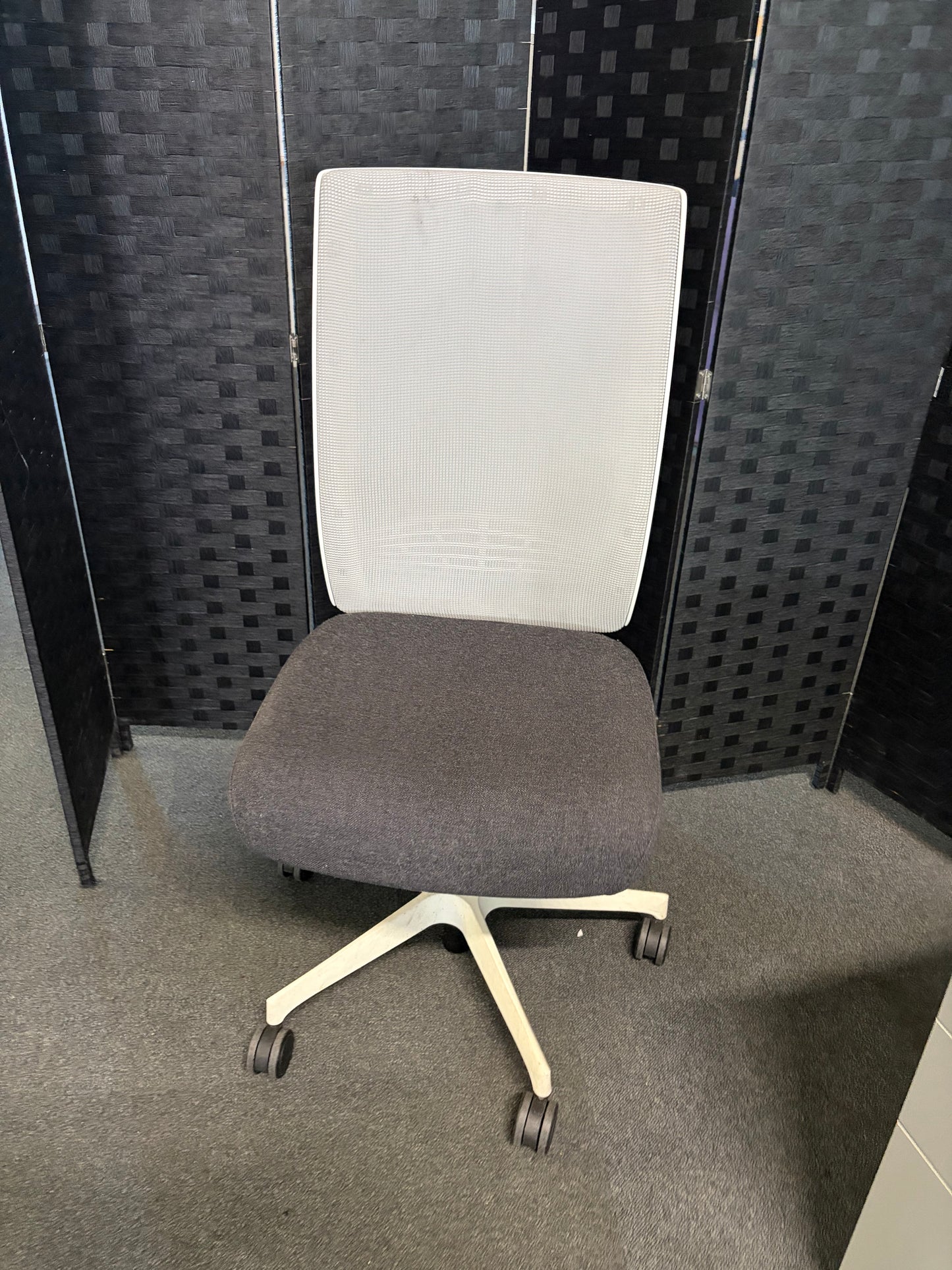 Used mesh-back operator chair striking white frame adjustable ergonomic dark grey upholstery