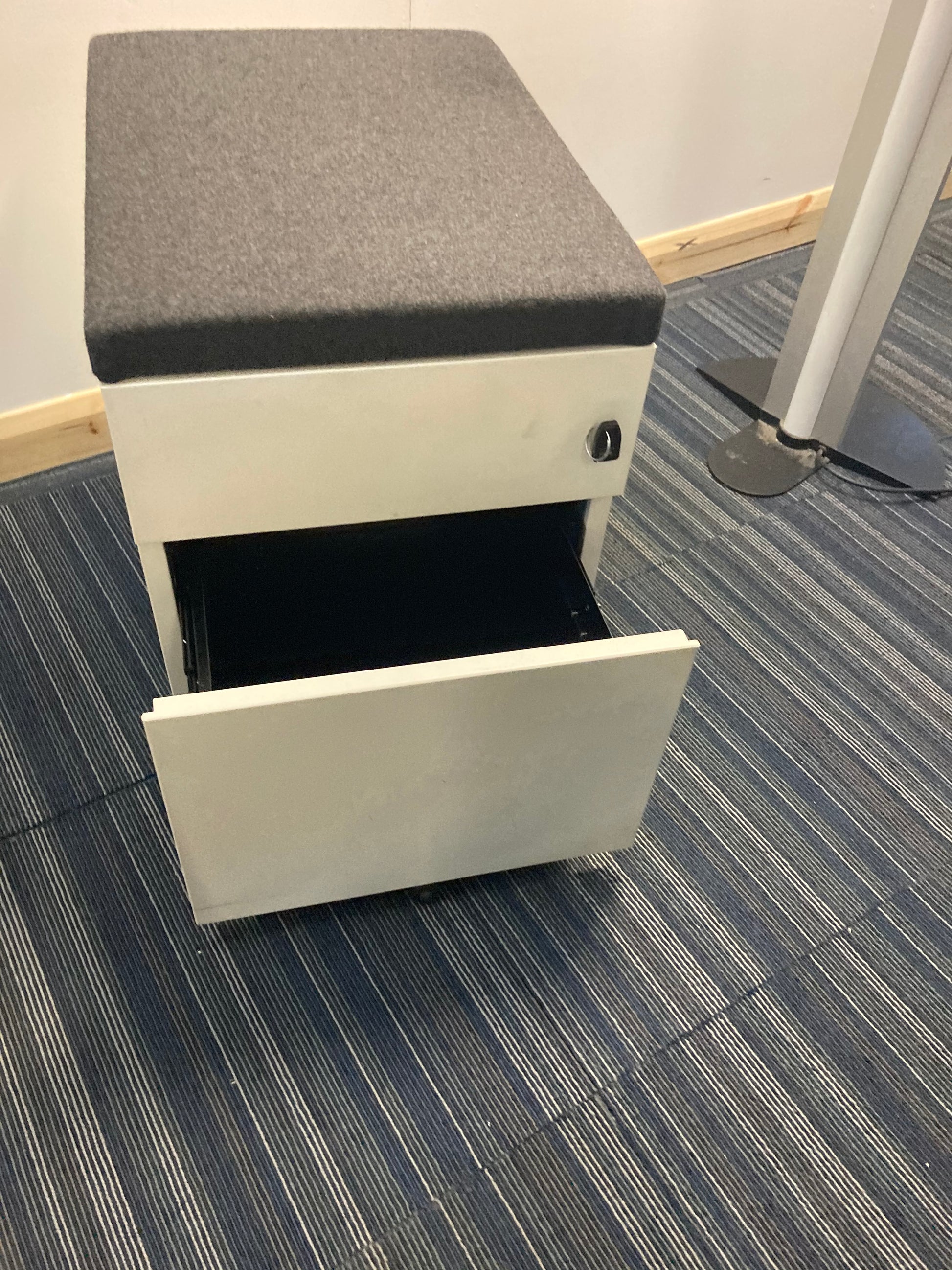 Padded top of white office drawers